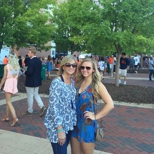 Blue romper with orange and tan flowers